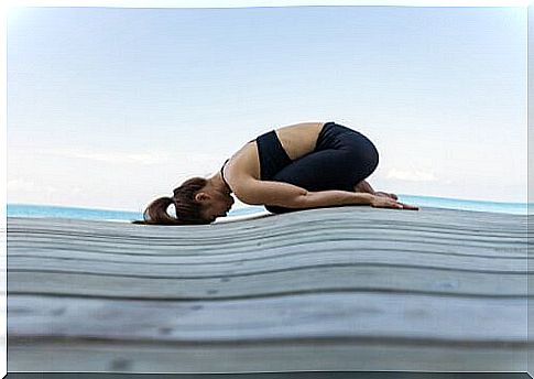 Woman doing yoga position Balasana