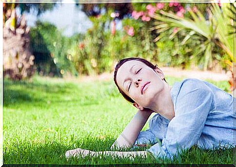 Woman lying in the grass.