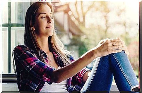 Woman sitting by the window.