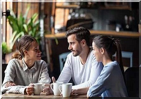 Friends discuss at coffee shop