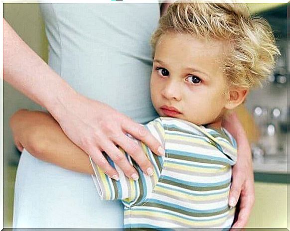 Boy hugging his mother.