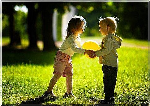 Children playing with a balloon.