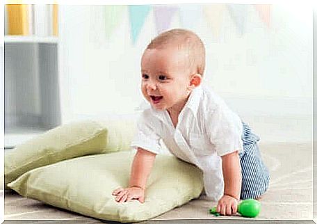 A baby on a pile of pillows