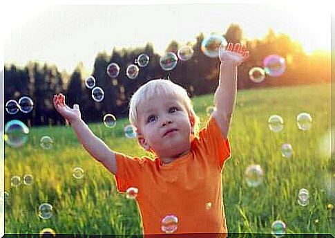 Children among bubbles.