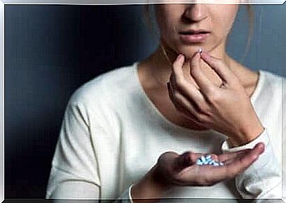 Woman taking pills.