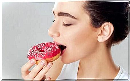 A woman eating a floating donut