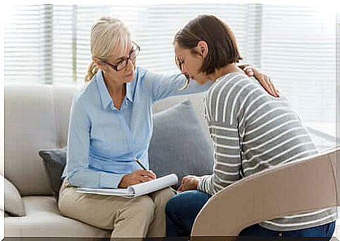 Woman sitting with therapist.