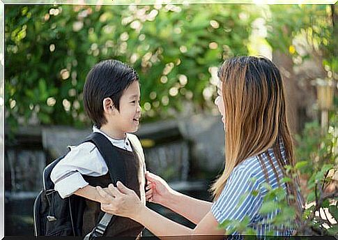 Happy boy wearing backpack.