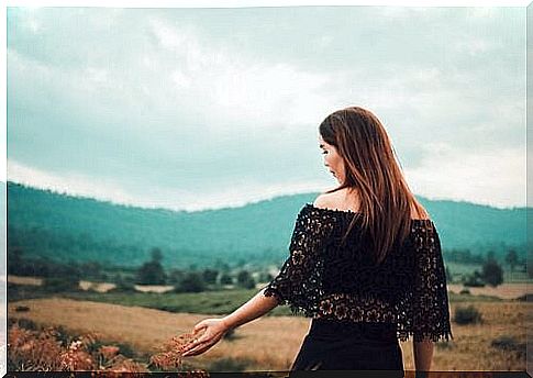 Woman walking on meadow.