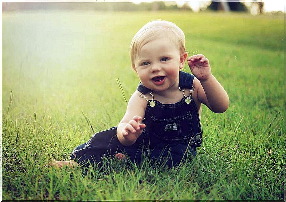 Baby playing in the grass 