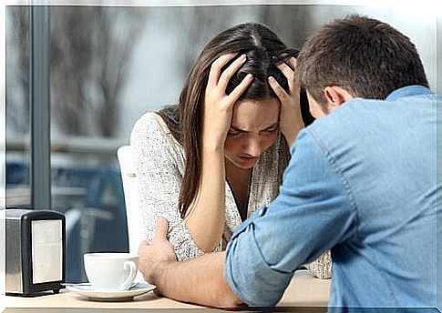 Couple arguing in a cafe